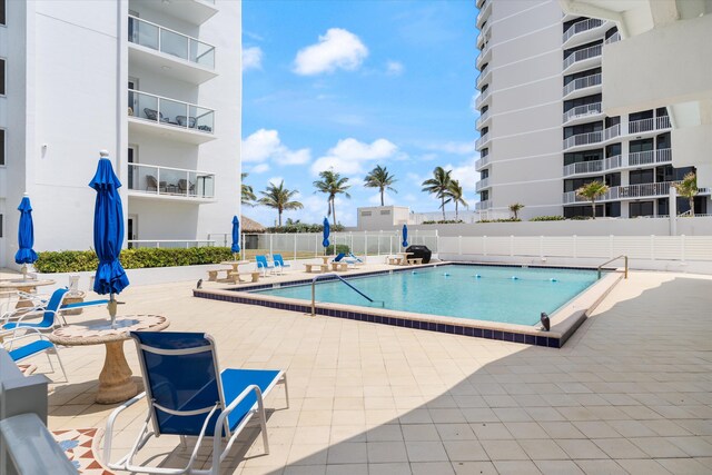 view of swimming pool featuring a patio