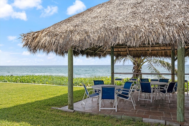 view of patio with a water view