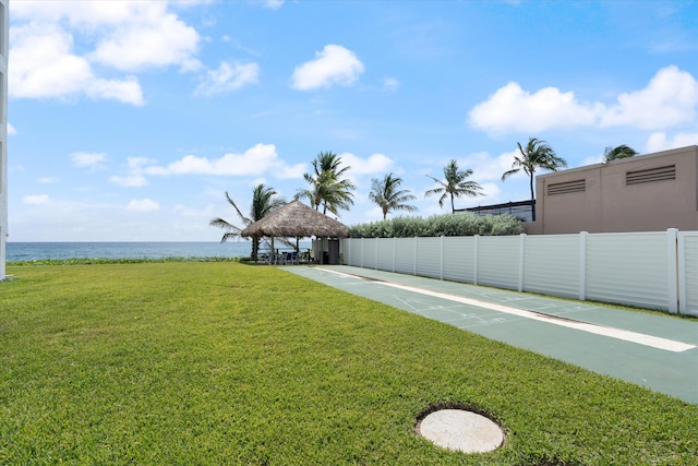 view of yard with a gazebo and a water view