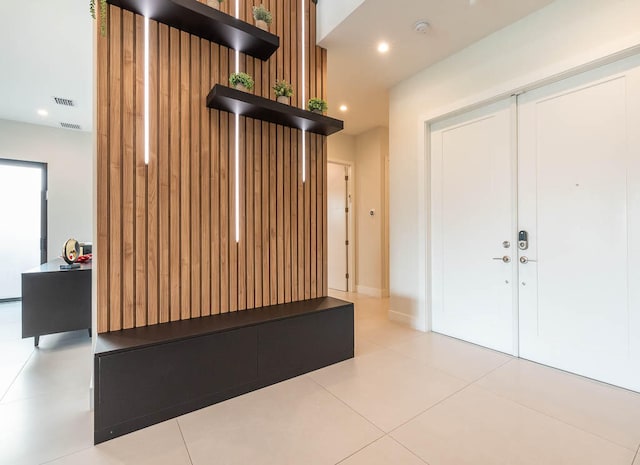 mudroom with light tile patterned flooring