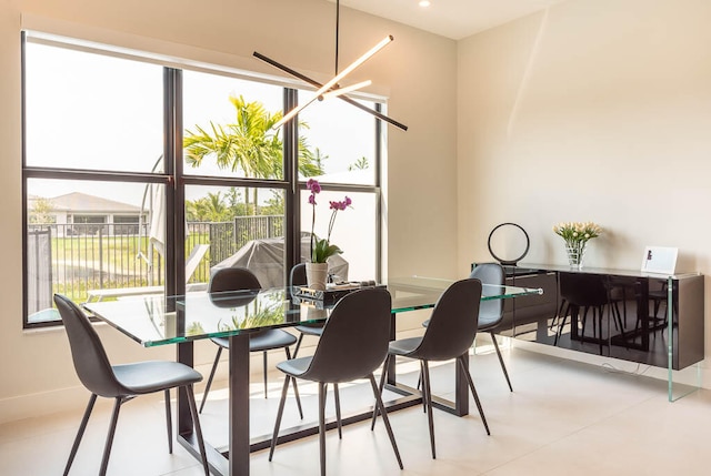 dining space with a chandelier and a healthy amount of sunlight