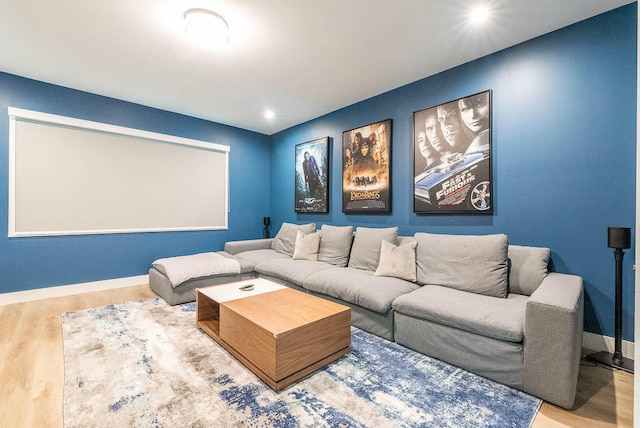 home theater room featuring hardwood / wood-style flooring