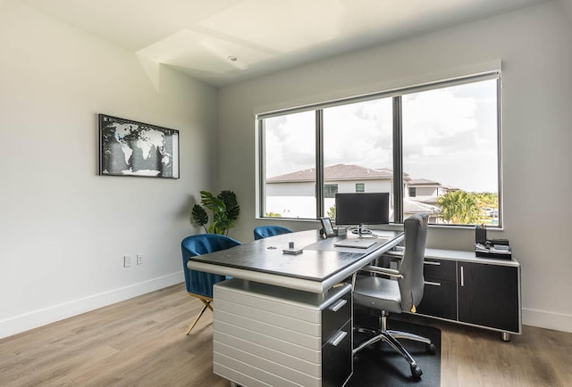 home office with light wood-type flooring