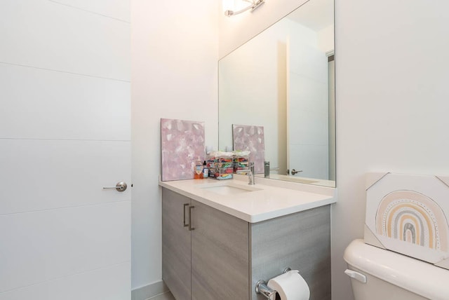 bathroom with vanity and toilet