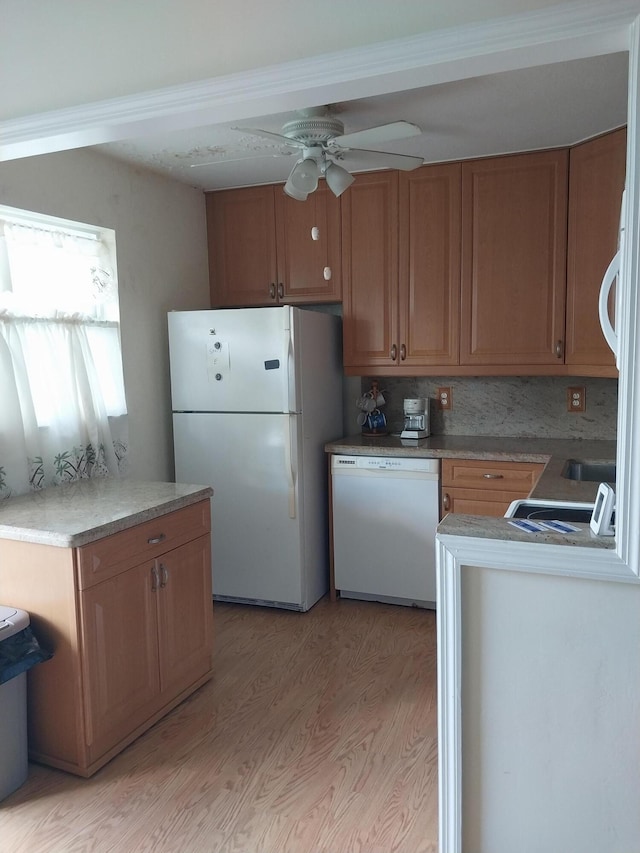 kitchen with decorative backsplash, light hardwood / wood-style floors, white appliances, and ceiling fan