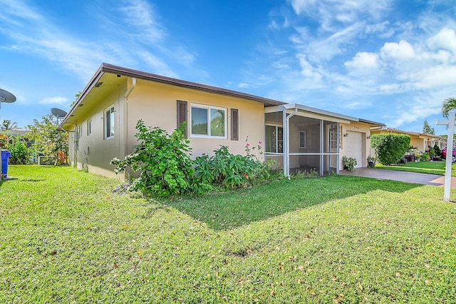 single story home with a sunroom and a front yard