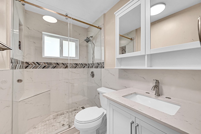 bathroom with vanity, backsplash, toilet, tile walls, and an enclosed shower