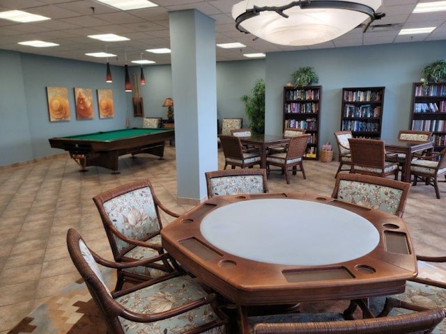 rec room featuring a paneled ceiling, light tile patterned floors, and billiards