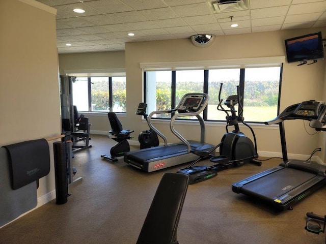 workout area featuring a drop ceiling, visible vents, baseboards, and recessed lighting