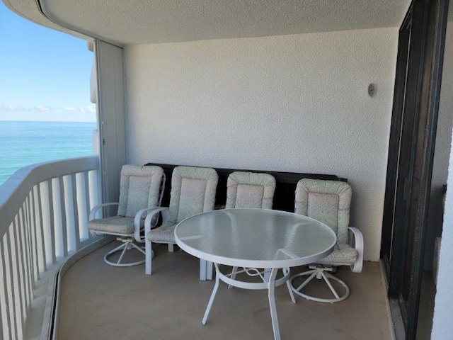 balcony featuring a water view