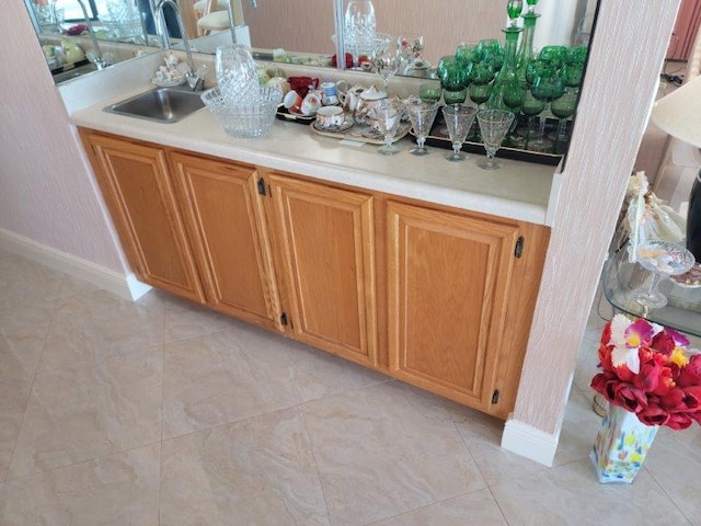 interior space with sink and light tile patterned floors