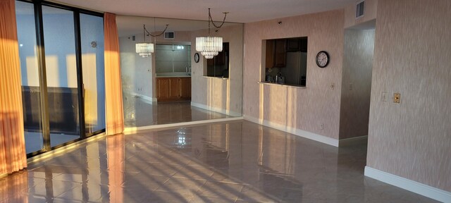 kitchen with black appliances, light tile patterned flooring, and sink