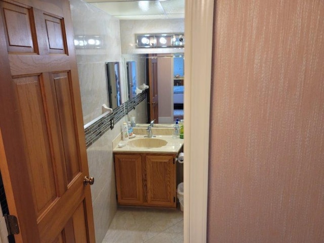 bathroom featuring tile patterned flooring and vanity