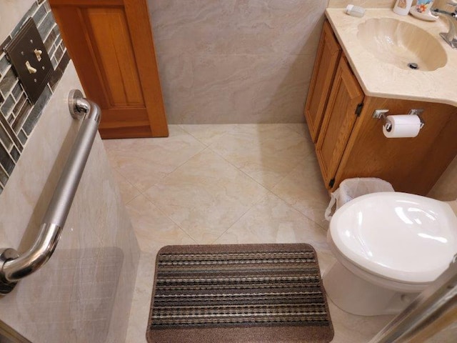 bathroom featuring toilet and vanity