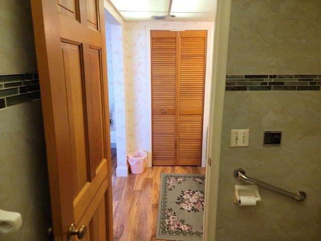 bathroom with hardwood / wood-style floors