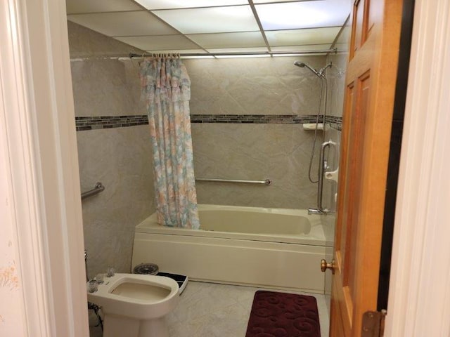 bathroom with shower / bath combo and tile patterned floors