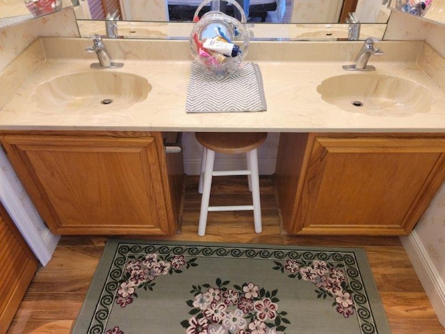 bathroom featuring hardwood / wood-style floors and vanity