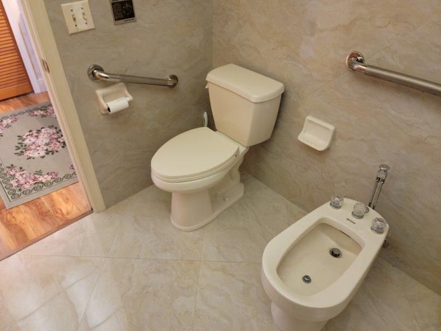 bathroom featuring a bidet and toilet