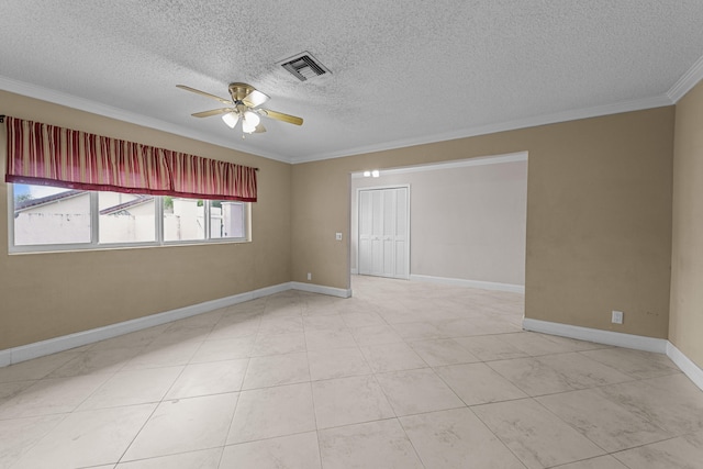 empty room featuring a textured ceiling, ceiling fan, and crown molding