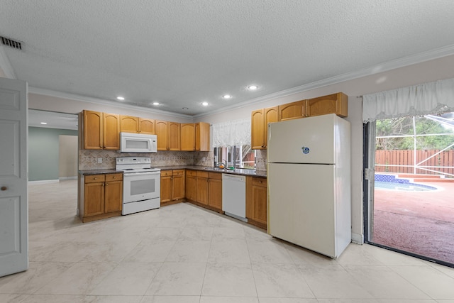 kitchen with decorative backsplash, white appliances, sink, and ornamental molding