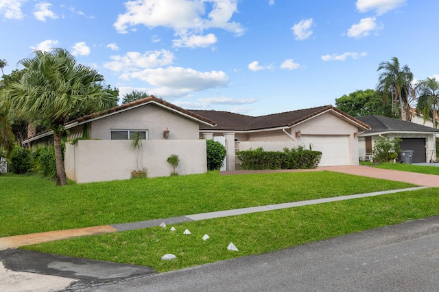 ranch-style house with a front yard and a garage