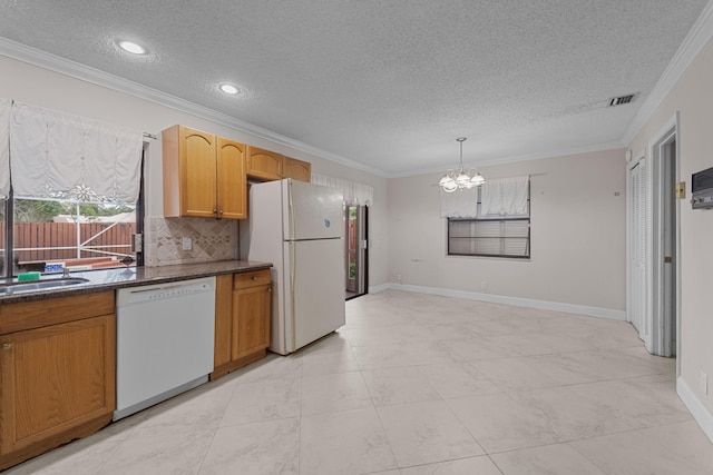 kitchen featuring pendant lighting, white appliances, a textured ceiling, and a chandelier