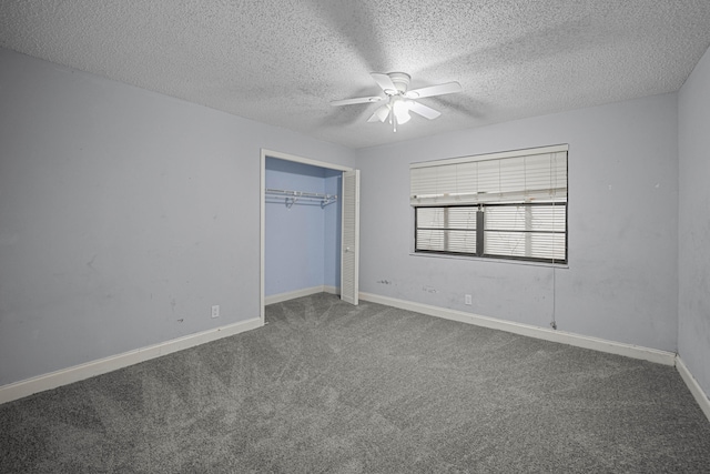 unfurnished bedroom with carpet flooring, ceiling fan, a closet, and a textured ceiling