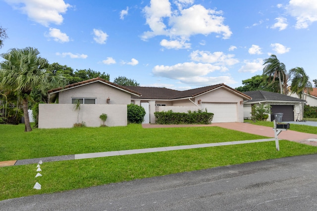 ranch-style house with a front yard and a garage