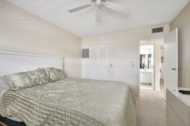 carpeted bedroom with ceiling fan and a closet