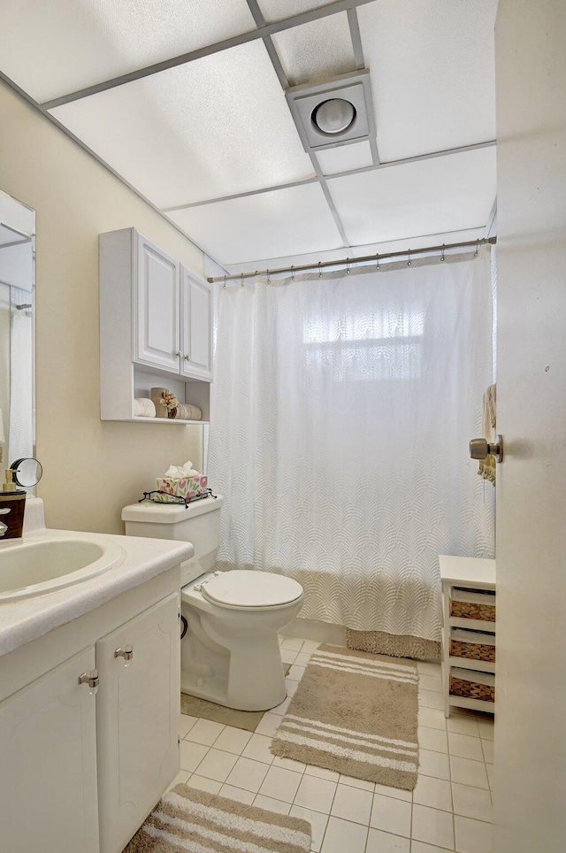 full bathroom with tile patterned flooring, vanity, toilet, and shower / tub combo with curtain