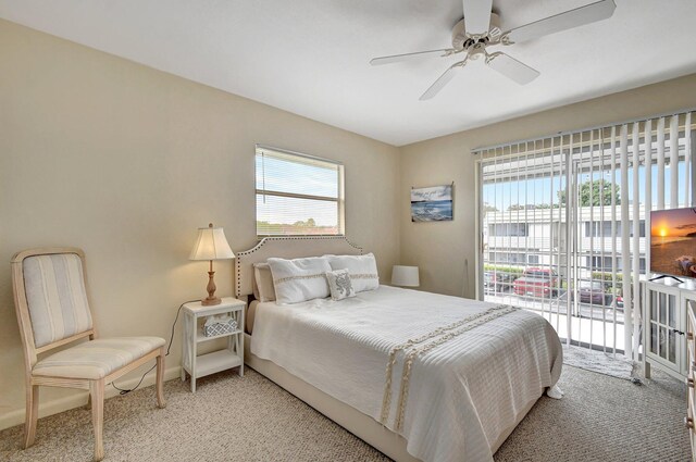 bedroom with access to outside, ceiling fan, and light colored carpet