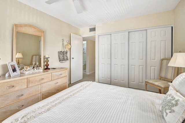 bedroom featuring carpet, ceiling fan, and a closet