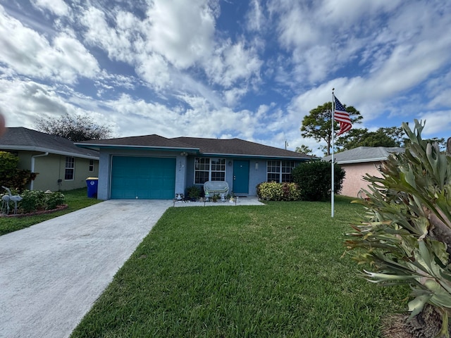 single story home with a garage and a front lawn