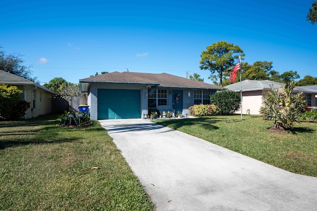 ranch-style home with a front lawn and a garage