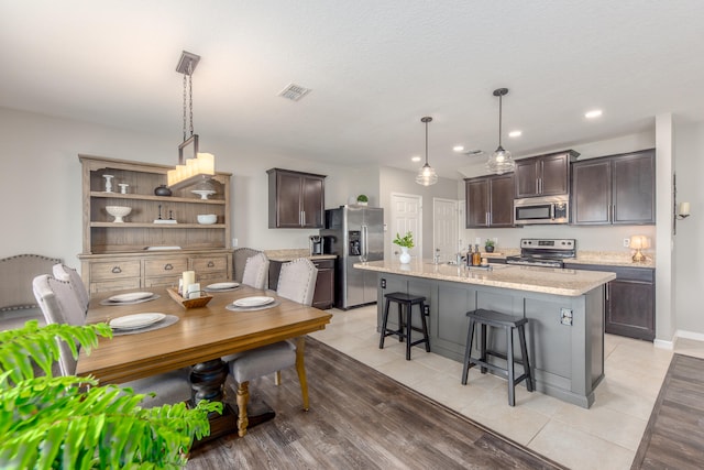 dining space with light hardwood / wood-style floors