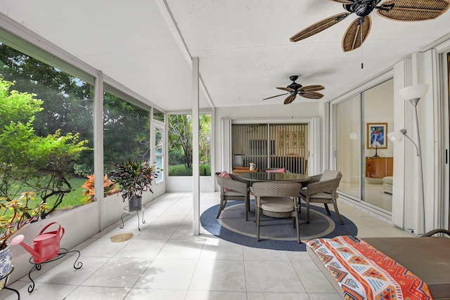 sunroom featuring ceiling fan