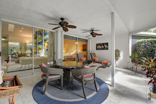 sunroom / solarium with ceiling fan and a healthy amount of sunlight