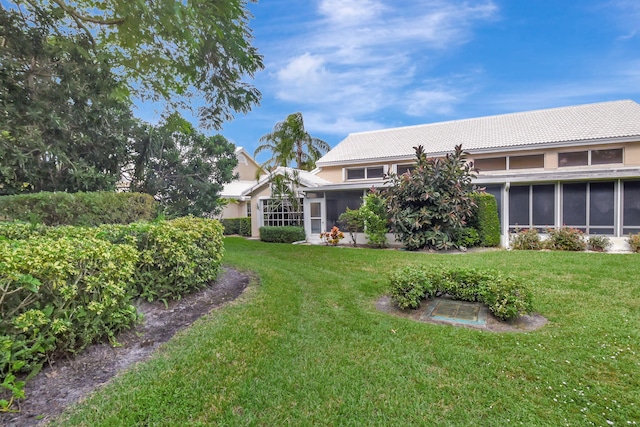 view of yard with a sunroom