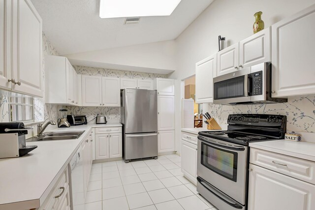 dining space with light tile patterned floors and high vaulted ceiling