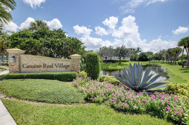 community sign with a water view