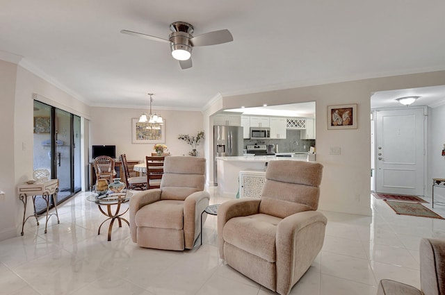 living room with ceiling fan with notable chandelier and ornamental molding