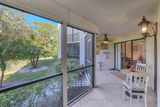 5750 Camino Del Sol Unit 102, Boca Raton, FL 33433 - unfurnished sunroom featuring ceiling fan