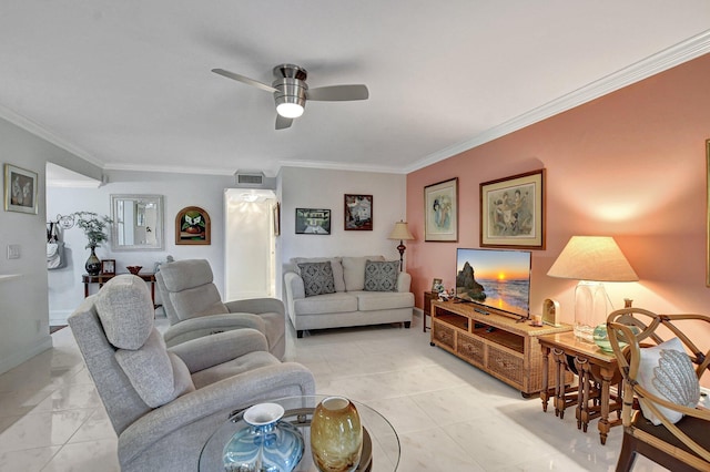 tiled living room with ceiling fan and crown molding