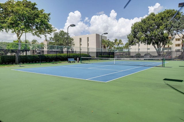 5750 Camino Del Sol Unit 102, Boca Raton, FL 33433 - view of tennis court featuring community basketball court and fence