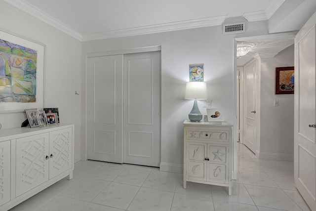 interior space featuring light tile patterned floors and crown molding