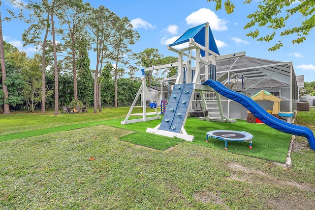 view of jungle gym featuring a lawn