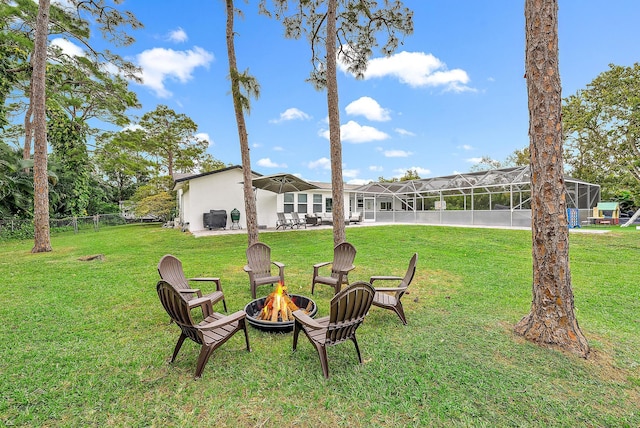 view of yard with a fire pit