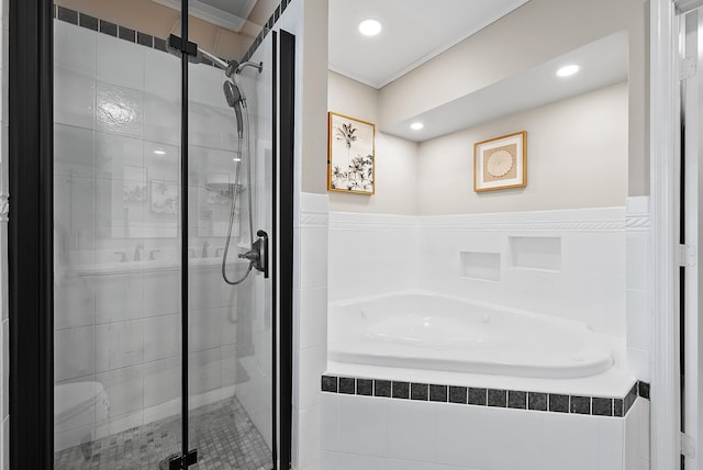 bathroom featuring crown molding and plus walk in shower