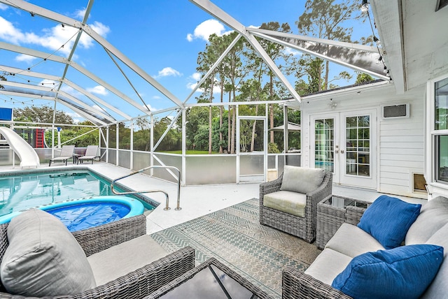 view of pool featuring a patio, glass enclosure, and a water slide