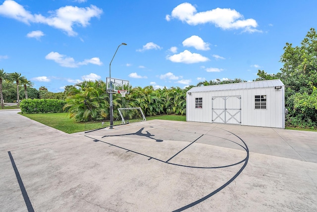 view of basketball court featuring a yard